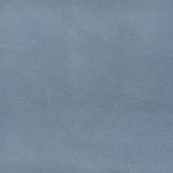 Nabuk leather texture sample in powder blue r827 col. 3431, exhibiting a soft, velvety, granular finish from MDF Italia’s special leathers collection.