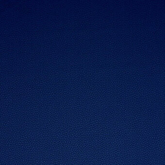 Platinum Flukso fabric sample, deep blue, fine-grained texture with circular indentations, matte finish, durable woven material.