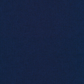 Dark indigo textile with a dense, uniform pattern of small square indentations and a matte finish, likely a woven fabric sample.
