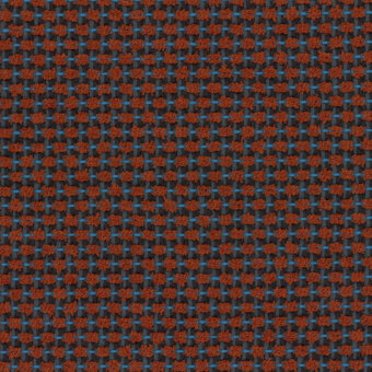 Woven textile pattern, terracotta orange, muted blue, and charcoal gray, featuring a grid-like structure with a dense, knotted texture.