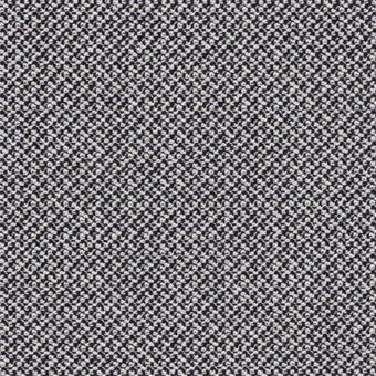 Black and white “Cleo Pepper” textile pattern with scattered, irregular dots and a granular texture, from the miniforms fabrics collection.