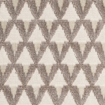 Geometric textile sample, dark brown and cream, repeating triangle pattern with textured weave; Dedal “g” collection, miniforms “amuleto alabastro”.
