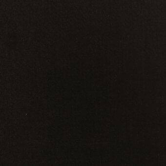 Black cotton fabric swatch displaying a tight weave texture, matte finish, and subtle grain; label reads “modo luce > fabrics > cotton > 313 black.”