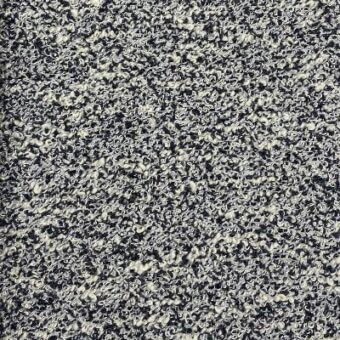Bouclé fabric texture sample, dark navy and off-white mottled weave, exhibiting a nubby looped surface with integrated fabric identification text.