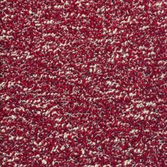 Red bouclé fabric texture with looped yarn, cream fiber speckles, and visible “moroso” textile labeling; upholstery material sample.