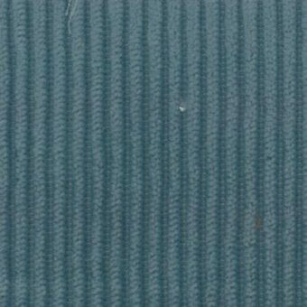 Ribbed fabric texture in teal-blue, displaying vertical parallel ridges and woven fibers; labeled “Moroso Floki Denim – Q” watermark.