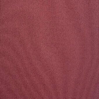 Burgundy herringbone fabric texture with a dense weave and matte finish, displaying subtle tonal variations in diagonal ridges.