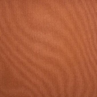 Terracotta woven fabric texture with a repeating geometric pattern, matte finish, and imprinted Moroso Getis Squash collection details: q, a9137.