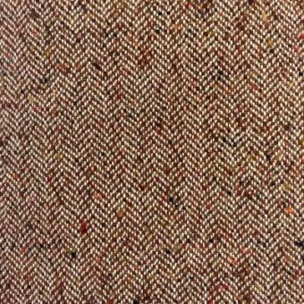 Herringbone fabric texture in brown, cream, orange, and black with a dense, nubby weave; label reads "moroso House of Lords A6941 brown".