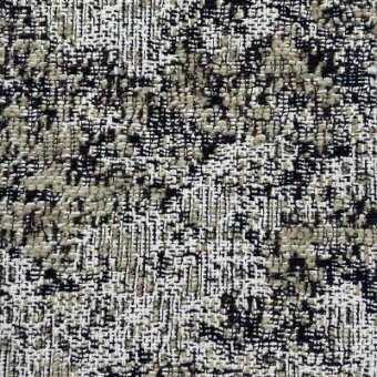 Moroso Nembro fabric, Gravel colorway, A7057, displays a dense woven texture of black, olive, and off-white yarns with a nubby, irregular pattern.