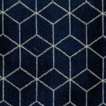 Geometric textile with interlocking dark and light blue hexagons in a woven grid pattern, labeled “Moroso block pattern blue.”