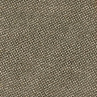 Sand-colored fabric sample displaying a dense, diagonal weave with visible threads and subtle tonal variations in a textured finish.