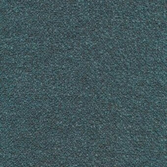 Teal fabric texture with granular surface, dark gray and black particles, rough matte finish, subtle mottling, and faint gray text overlay.