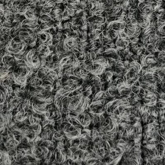 Moroso Gorky fabric, dark grey, densely looped texture with coiled spirals and a matte finish, neutral grey background.