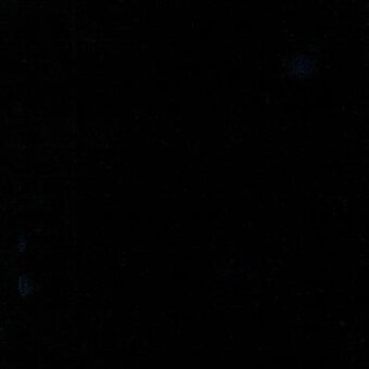 Dark blue woven fabric swatch with scattered white and light blue speckles, matte texture, manufacturer detail visible, black background.