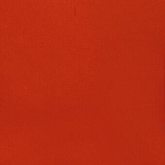 Red textured fabric, likely synthetic leather, fills the frame; studio shot displays a matte terracotta tone with subtle grain and product text overlay.