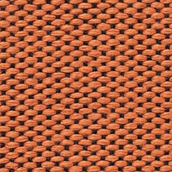 Woven fabric texture, muted peach tone, repeating grid of small rectangles with dark interlacing threads, dense weave, natural yarn variations.