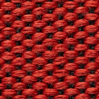 Woven fabric texture, watermelon red and dark gray, repeating circular pattern with looped pile construction and dense, nubby surface.