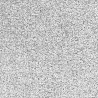 Looped pile fabric, light gray, plush texture with subtle irregularities and dark flecks; matte finish, textile sample labeled “Moroso yeti crystal water”.