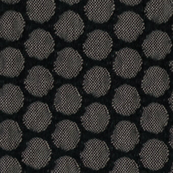 Black mesh fabric texture with repeating circular nodules, woven grid structure, and gray background; Moroso “pimple” fabric sample A4233.