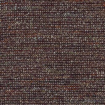 Woven fabric swatch, dark brown and orange-brown striped texture, granular weave with gray and beige flecks, “moroso polka” label visible.
