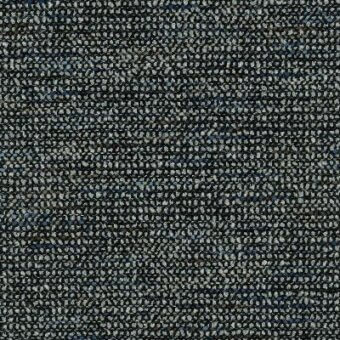 Charcoal gray fabric sample with pebble-like texture, blue and light gray threads, horizontal weave, and “moroso polka” label visible.