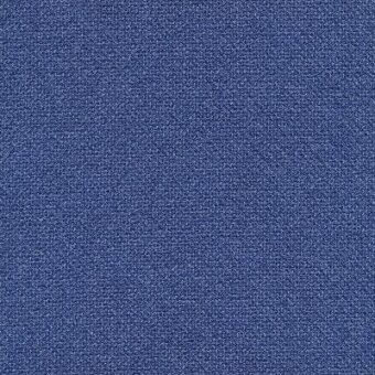Denim fabric sample, deep blue woven texture, granular surface with tonal variations, consistent pattern, “rico 989.400 denim” label visible.
