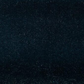 Sapphire blue fabric texture with a densely felted surface of interwoven fibers, exhibiting nuanced depth and a subtly irregular appearance.
