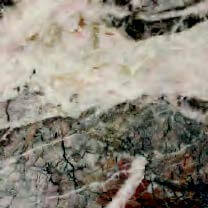 Gray and brown fractured stone surface with pinkish-white veining, layered texture, and thin white streaks; natural marble detail.