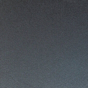 Matte graphite metal texture with fine granular detail, displaying a consistent muted gray tone and even diffused lighting across a flat surface.