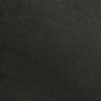 Dark gray fabric sample displaying a dense, granular woven texture with mottled tonal variations and white “pacini & cappellini” branding.