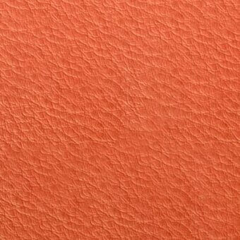 Terracotta leather texture sample with matte finish, exhibiting a repeating pebble grain pattern and dense, subtly uneven surface; pacini & cappellini mattone 9004.