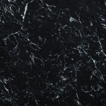 NM Black Marquinia marble texture features deep black stone with branching white and light gray veins, creating a dense, organic pattern.