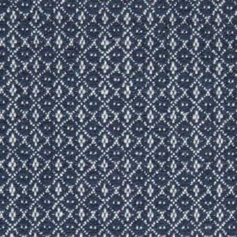Navy geometric fabric sample with repeating diamond motifs in off-white, featuring a textured weave and heathered yarn blend, Porada collection.