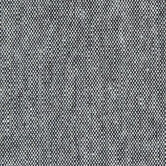 Woven fabric texture, grayscale color scheme, dense irregular dot pattern with mottled appearance, close-up material sample.