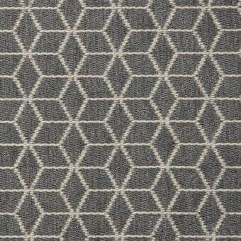 Geometric textile sample featuring interlocking beige hexagons on a medium gray background, with a tight weave and matte finish.