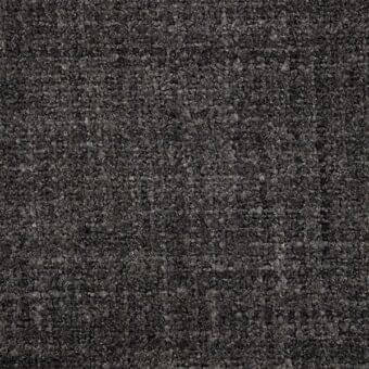 Dark gray fabric texture, densely woven with irregular fibers, exhibiting mottled charcoal and silver-gray tones, matte finish, Porada collection.