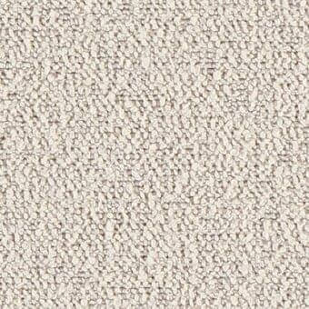 Beige granular texture displaying densely packed, matte particles with irregular, slightly elongated shapes and uniform color distribution.