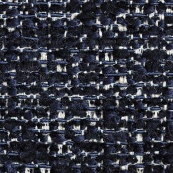 Navy and off-white tweed fabric sample with a grid pattern, dense nubby texture, and interwoven horizontal/vertical yarns from Potocco coverings.