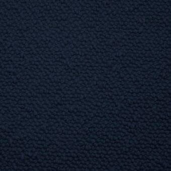 Dark blue Potocco Dafne B2E Blu Oltremare fabric with a dense, nubby texture and consistent small rounded bumps, suitable for upholstery.