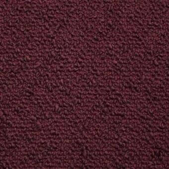 Dafne B2H Rubino fabric by Potocco, a textured ruby red indoor upholstery with a looped pile and granular surface.