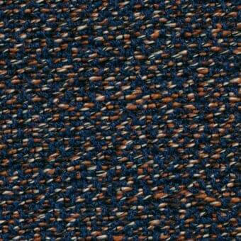 Potocco Delta B1F Blu Mattone fabric texture, navy and brick red woven upholstery with dense, irregular nubby weave and matte finish.