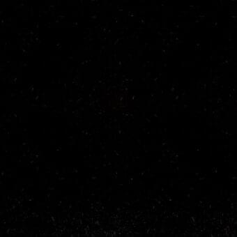 Potocco Doro H3B Nero fabric swatch displays a dense, granular black texture with a tightly woven, mottled surface for upholstery.