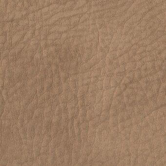 Nabuk leather texture, nocciola e2q color, soft velvety finish with subtle mottling and creases from Potocco coverings collection.