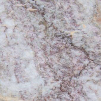 Fior di Pesco Carnico marble texture with swirling pink, lavender, and gray veins on a white background, polished finish.