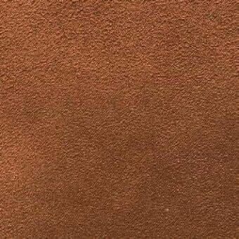 Brown fabric texture with granular surface and subtle mottling, displaying a woven or felted material with uneven, warm tones.