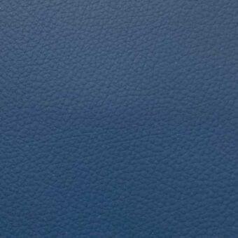 Deep blue synthetic leather texture with a uniform, subtly pebbled surface and matte finish displayed against a neutral backdrop.