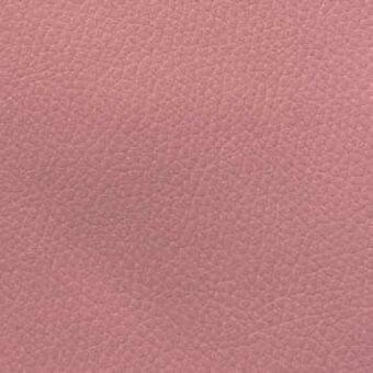 Pink leather-like fabric texture with a pebbled surface and muted dusty rose color, displaying a fine grain pattern.