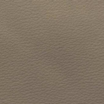Pebbled fabric texture in warm gray showcases a matte finish with a fine grain pattern of small, raised dots and consistent taupe tone.