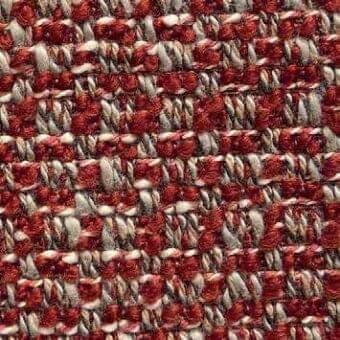 Woven tweed fabric with rust red and beige yarns in an irregular pattern, exhibiting a dense, matte, nubby texture; label reads “presotto tav117b”.
